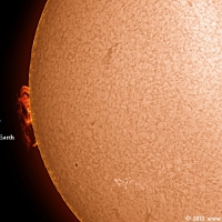 Huge Prominence and the Earth to Scale