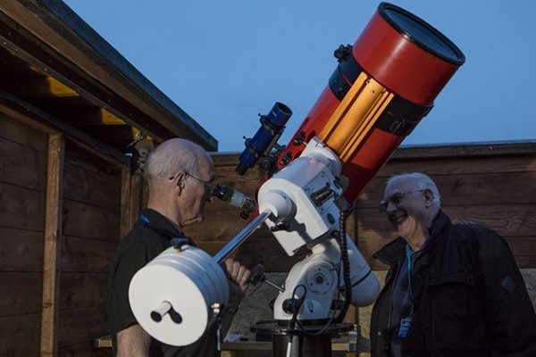 Dave Tatters (left) and Stewart Hepton (right) of Sunderland Astronomical Society inspect the newly-refurbished Grubb-Parsons Perseus. Te;lescope